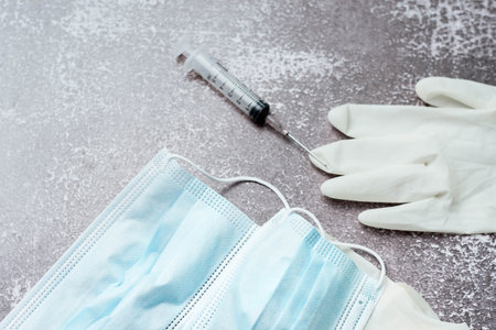 Medical waste from vaccinations, medical gloves, syringes, masks.の写真素材