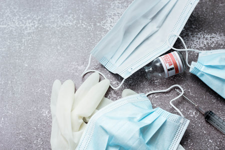 Medical waste from vaccinations, medical gloves, syringes, masks.の写真素材