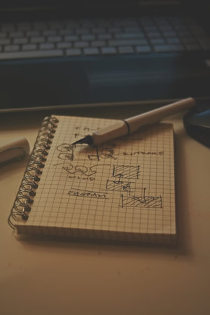 Pencil and notepad on the desk. Vintage color tone.