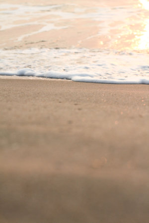 The sun is rising, the sun is bright, the morning sea at Cha-Am Beach, Thailand.の写真素材