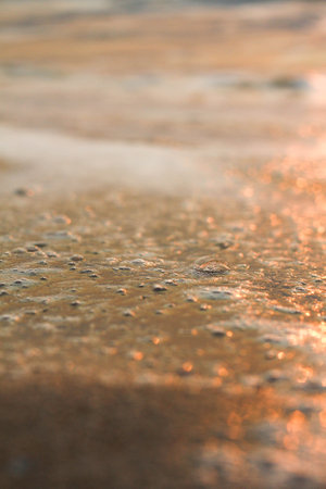 The sun is rising, the sun is bright, the morning sea at Cha-Am Beach, Thailand.の写真素材