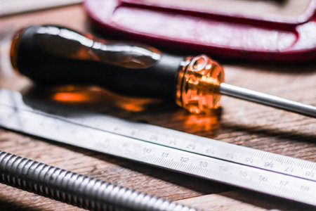 Collection of woodworking tools on a wooden background.の写真素材