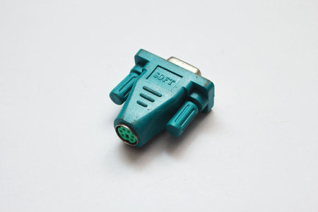 The blue-green serial connector looks similar to the blue VGA connector on a white background.