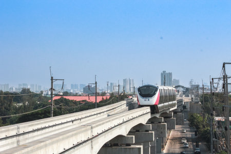 Bangkok, Thailand - January 09 2024 -The electric train runs on tracks above the streets of Bangkok....