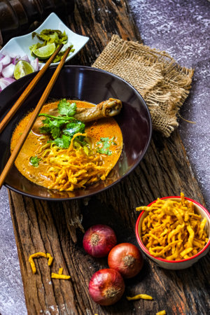 Khao Soi Thai Curry soup isolated in black backgroundの写真素材