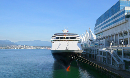 Vancouver Cruise Ship Center at Canada Place.  Downtown Vancouver, Canada. A cruise ship tied up at dock on a sunny day.の写真素材