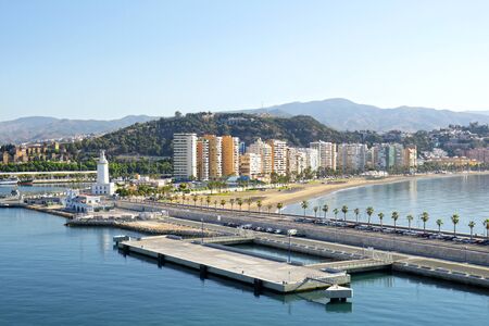 Cityscape of cruise ship terminal, waterfront and beach in Malaga, Andalusia, Spainの写真素材