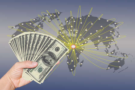 hand holding stack of 100 dollarsの写真素材