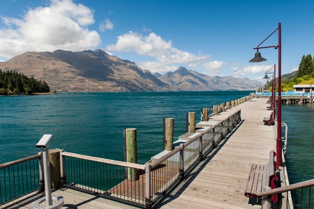 Wooden pier at Wakatipu lake, New zealandの写真素材