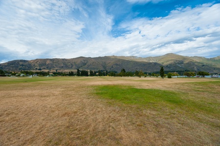ountain range with green meadow, Wanaka, New Zealand の写真素材
