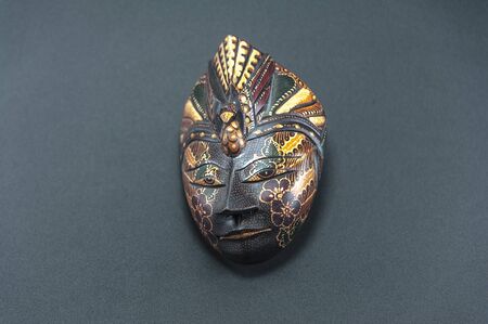Batik wooden indonesian mask isolated on black backgroundの写真素材