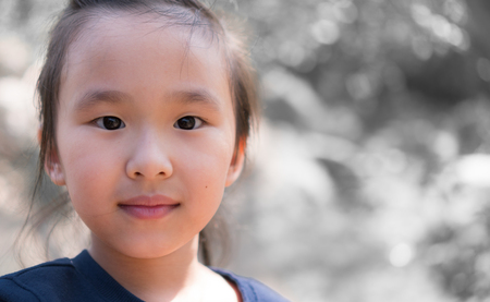 Asian girl smiles cuteの写真素材