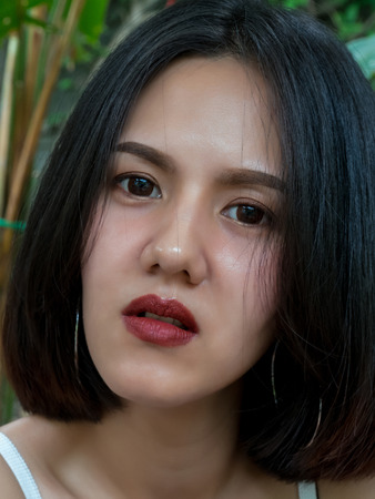 Portrait cheerful beautiful woman: Attractive woman has nice smile. Charming girl has beautiful face and nice skin. Gorgeous female has mixed race between English and Thai. Glamour lady feels happy.の写真素材