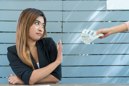Businessman refusing to take bribe. She expresses a lack of financial bribes.の写真素材