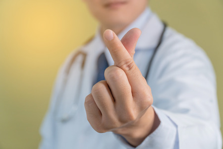 Close Up The doctor's hand. Doctors make a heart shape (MINI HEART). Send a message to care.の写真素材