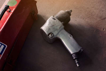 Air impact wrench in service shop repairing.の写真素材