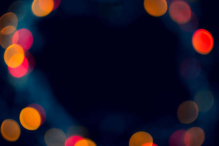 Circle bokeh blurred abstract on black background with copy space.