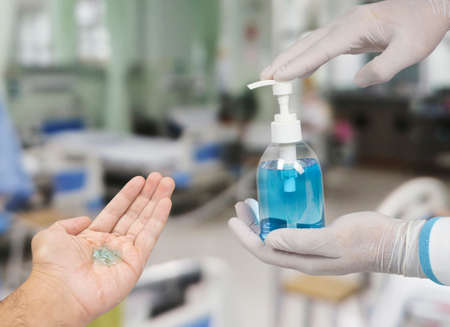 Ethyl alcohol sanitizer in a hand of the doctor for cleaning hand and used as disinfectant,Covid-19,Corona virus.の写真素材