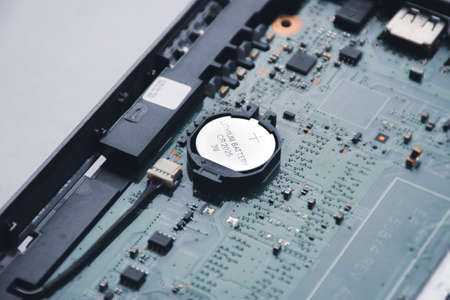 Button cell lithium battery CR2025 3V on the motherboard of laptop