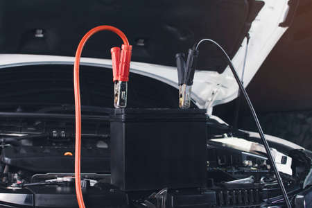 Charger cable clamping to the car battery,accumulator chargingの写真素材