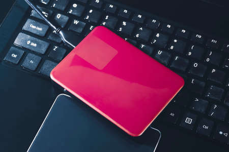 External hard disk 2.5 inch on the laptop keyboard