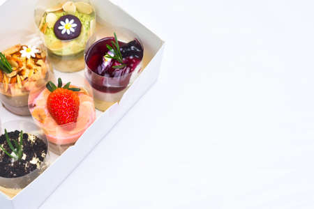 Strawberry Cheesecake with fresh strawberries on top and different flavors of cheesecake with copy...