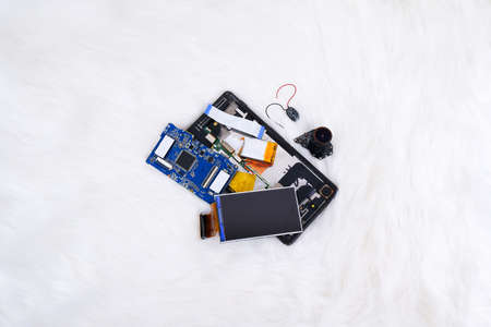 Electronics waste including a lcd screen,a electronic board,a battery,a camera lens and smartphone...
