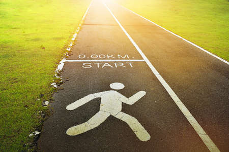 The line beginning on a paved road with sunlight coming from its destination and running symbol on...