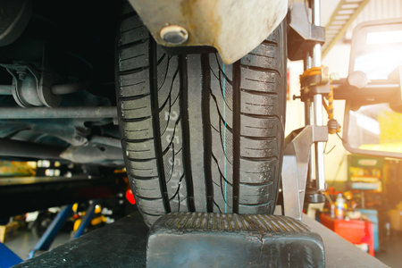 Close up of a new tire tread of a car in a auto tire shop, automobile maintenance service business conceptの写真素材