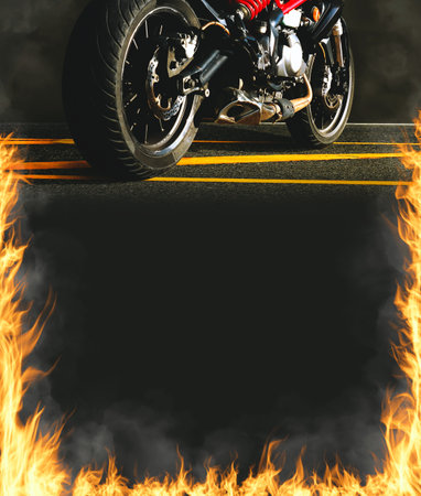 Motorbike and fire flames on vertical black frame background with copy spaceの写真素材