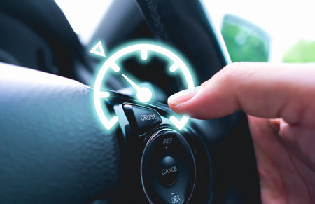 Automotive cruise control system on the steering wheel of the car with speedometer lock indicator...