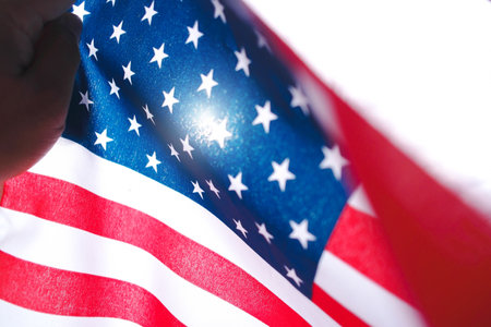 Happy independence day concept , American flags wave close with sunlight