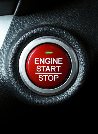 Close up of engine start stop button on car dashboardの写真素材