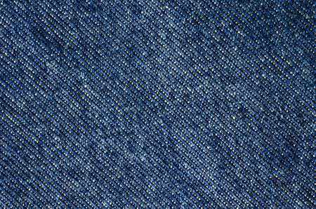 Texture of blue jeans textile close up