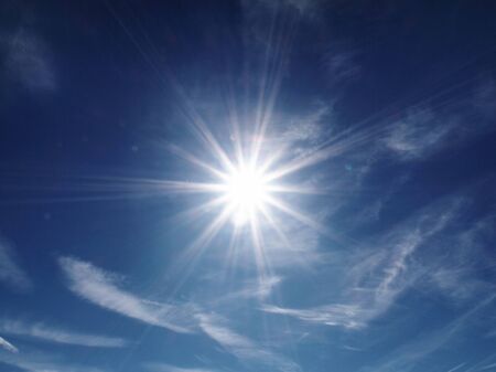 Look at the blue sky with the sunの写真素材
