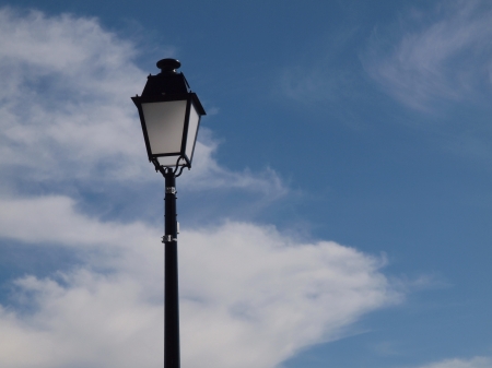 Street lighting in front of blue skyの写真素材
