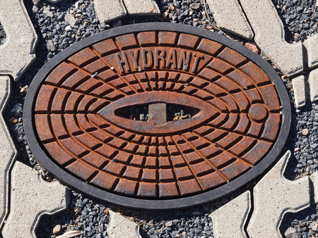 Road cap of an underground hydrantの写真素材