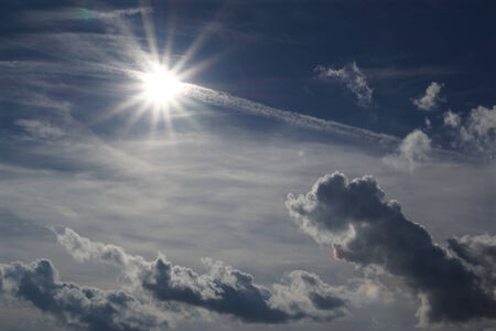 Clouds and sun in the skyの写真素材