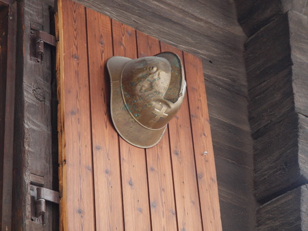 Swiss fire helmet on a house in Vispの写真素材