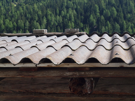 Old cement fiber boards on the roofの写真素材