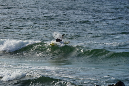 Paddler in the waves of the Baltic Sea