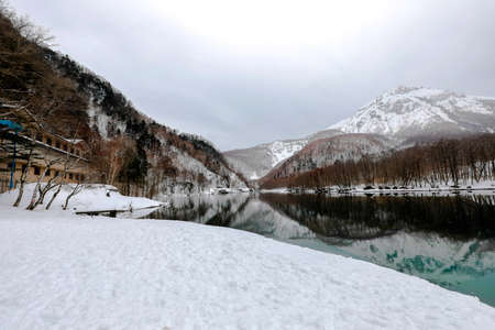 Landscape of snow mountain with rivers at the Kamikochi in Japan Alps Mountain. Winter season...