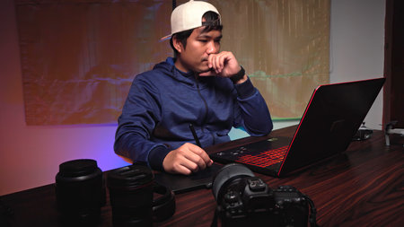 The editor is editing the video at the computerの写真素材