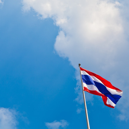 Thai flag on blue sky backgroundの写真素材
