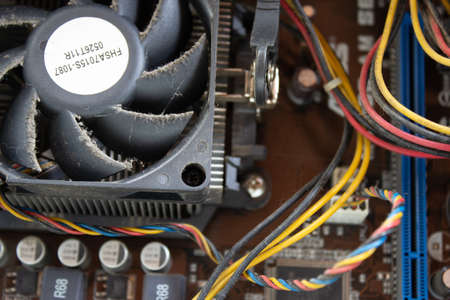 An old family computer filled with spider webs, dust and viruses. Maintenance is a key to keep computers healthy and working.の写真素材