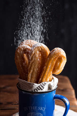Churros in coffee mugの写真素材