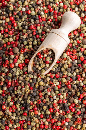 Overhead view of dried pink peppercorn and black pepperの写真素材
