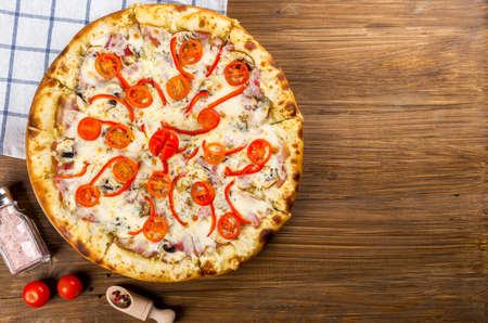 Red pepper and tomato pizzaの写真素材