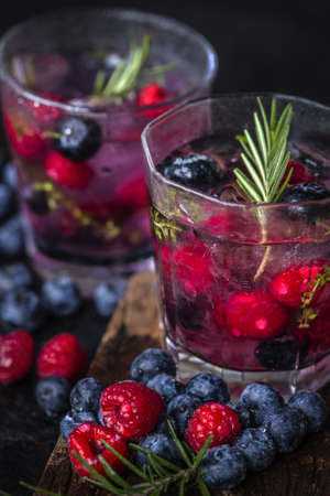 Close up of chilled beverage with blueberry and raspberryの写真素材