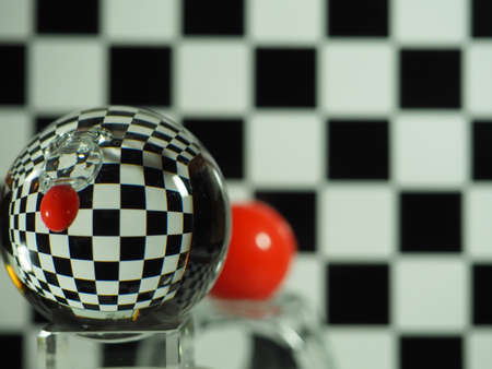 A glass ball around some places with reflectionsの写真素材